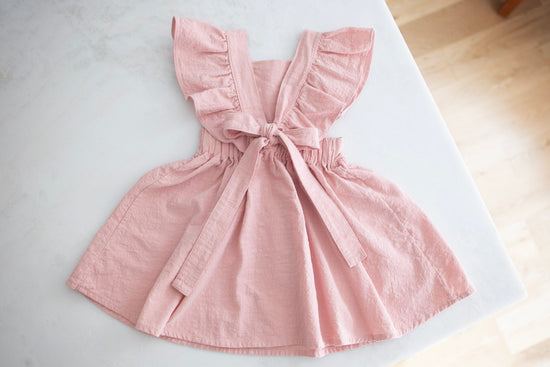 Blush Pink Baby Dress with ruffle sleeves and back bow - Cheerful Lane