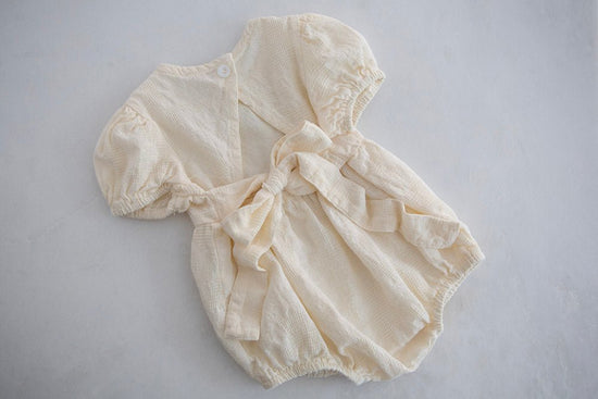 Cream Baby Girl Romper with Back Bow - Cheerful Lane