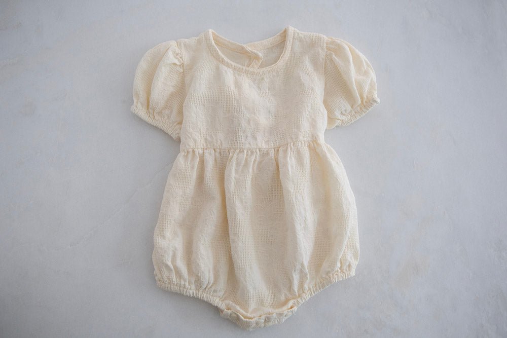 Cream Baby Girl Romper with Back Bow - Cheerful Lane